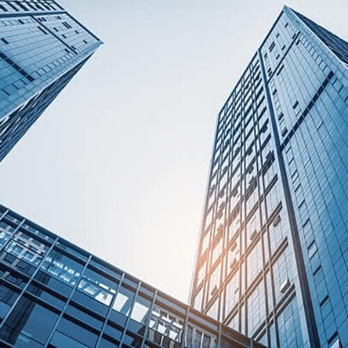 pngtree-skyscraper-modern-architecture-in-city-with-sunlight-office-building-with-glass-image_1059585